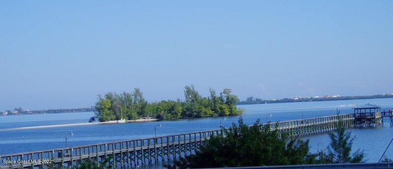 915 Fir Street Sebastian, FL 32976 - Photo 23 of 33 a view of a lake and a yard from a balcony