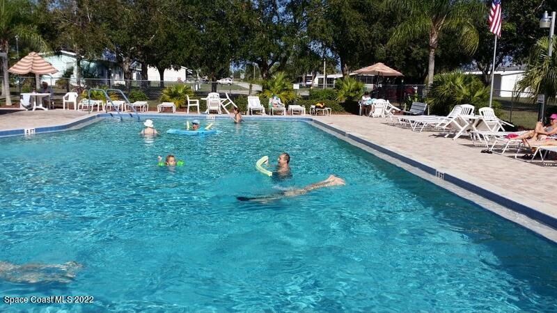 915 Fir Street Sebastian, FL 32976 - Photo 26 of 33 a view of yard with swimming pool and sitting area