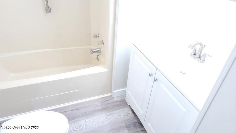 915 Fir Street Sebastian, FL 32976 - Photo 8 of 33 a bathroom with a tub and shower