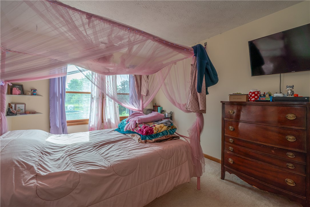 3628 Petre Road Springfield, OH 45502 - Photo 24 of 52 This cozy bedroom offers a tranquil retreat with ample natural light.