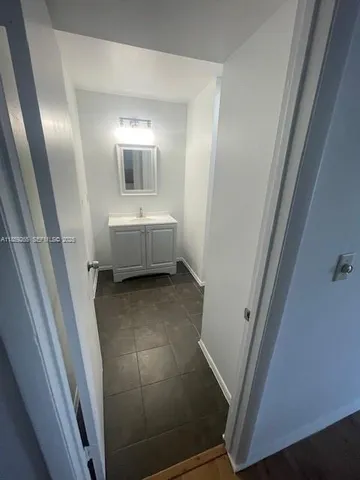 a bathroom with a sink and mirror