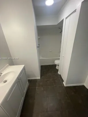 a bathroom with a sink and a toilet
