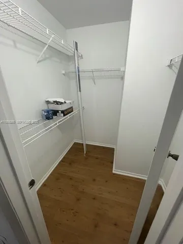 a view of a storage and utility room with a sink