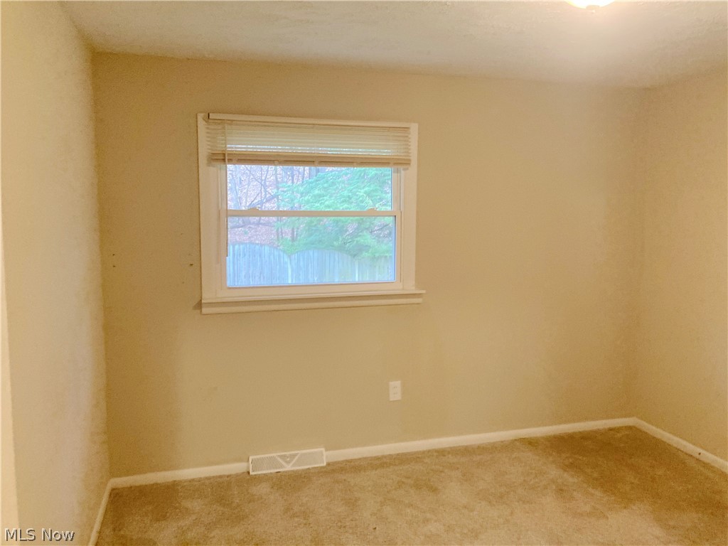 4953 Stevens Road Akron, OH 44319 - Photo 8 of 14 Empty room featuring carpet