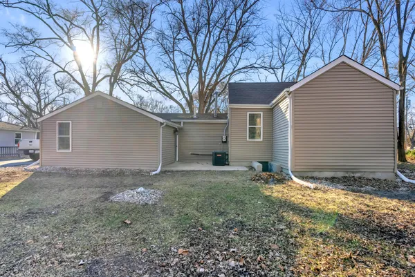 a view of a house with a yard and garage