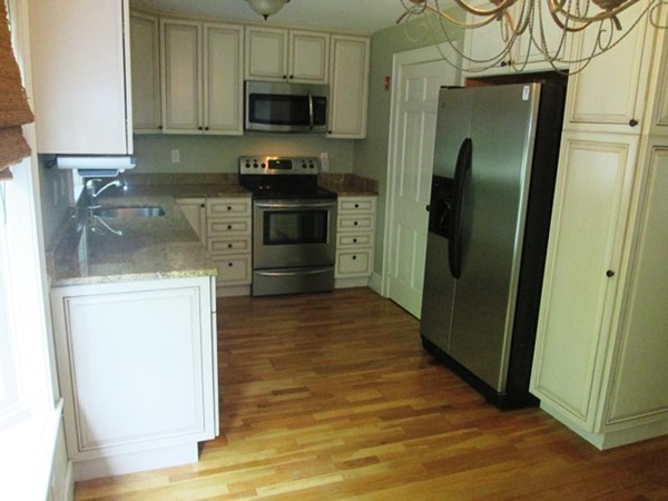 9 Alden Road Needham, MA 02492 - Photo 7 of 16 a kitchen with stainless steel appliances a refrigerator stove and sink