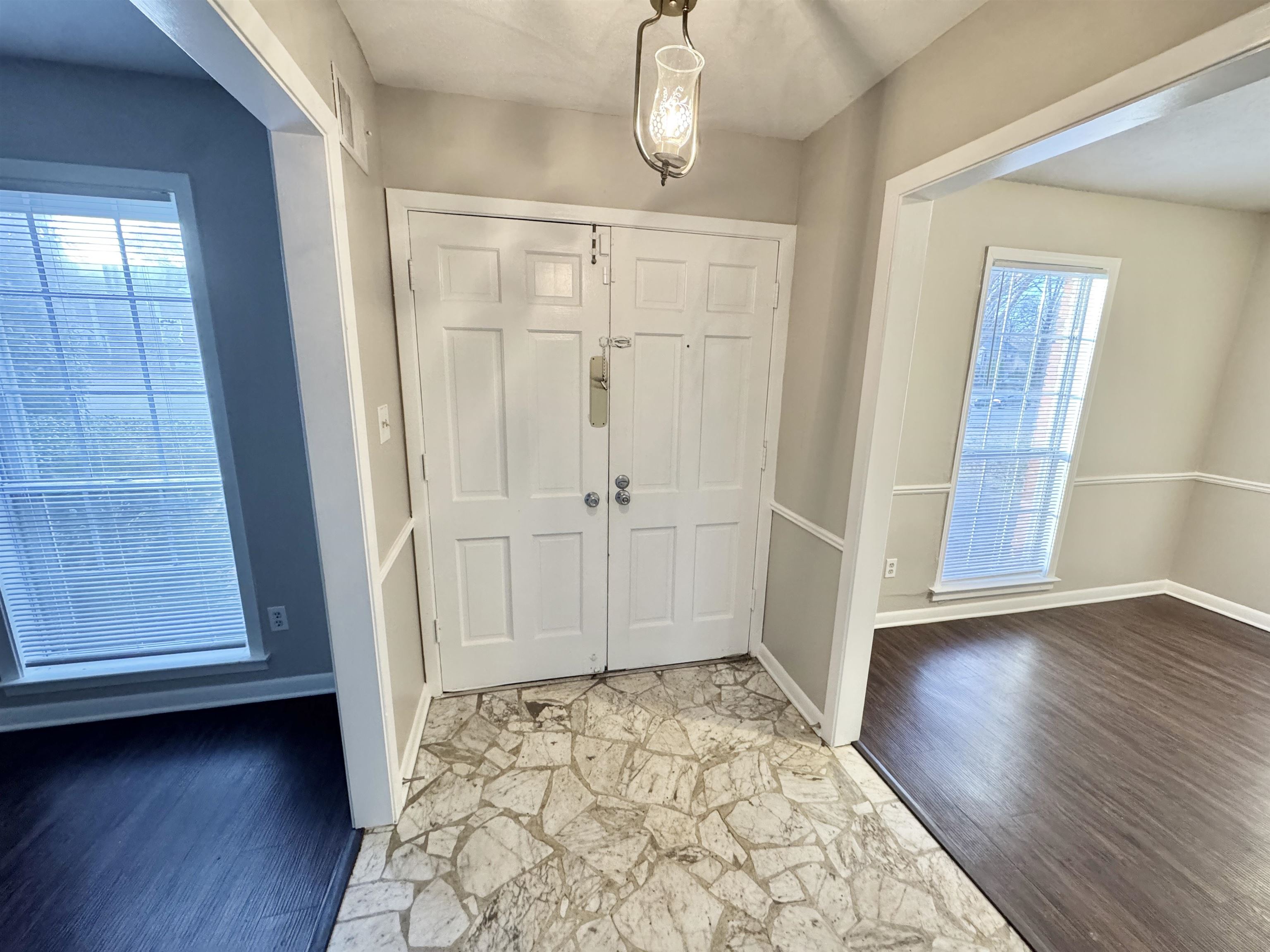 3174 Emerald Street Memphis, TN 38115 - Photo 10 of 28 an empty room with wooden floor and door