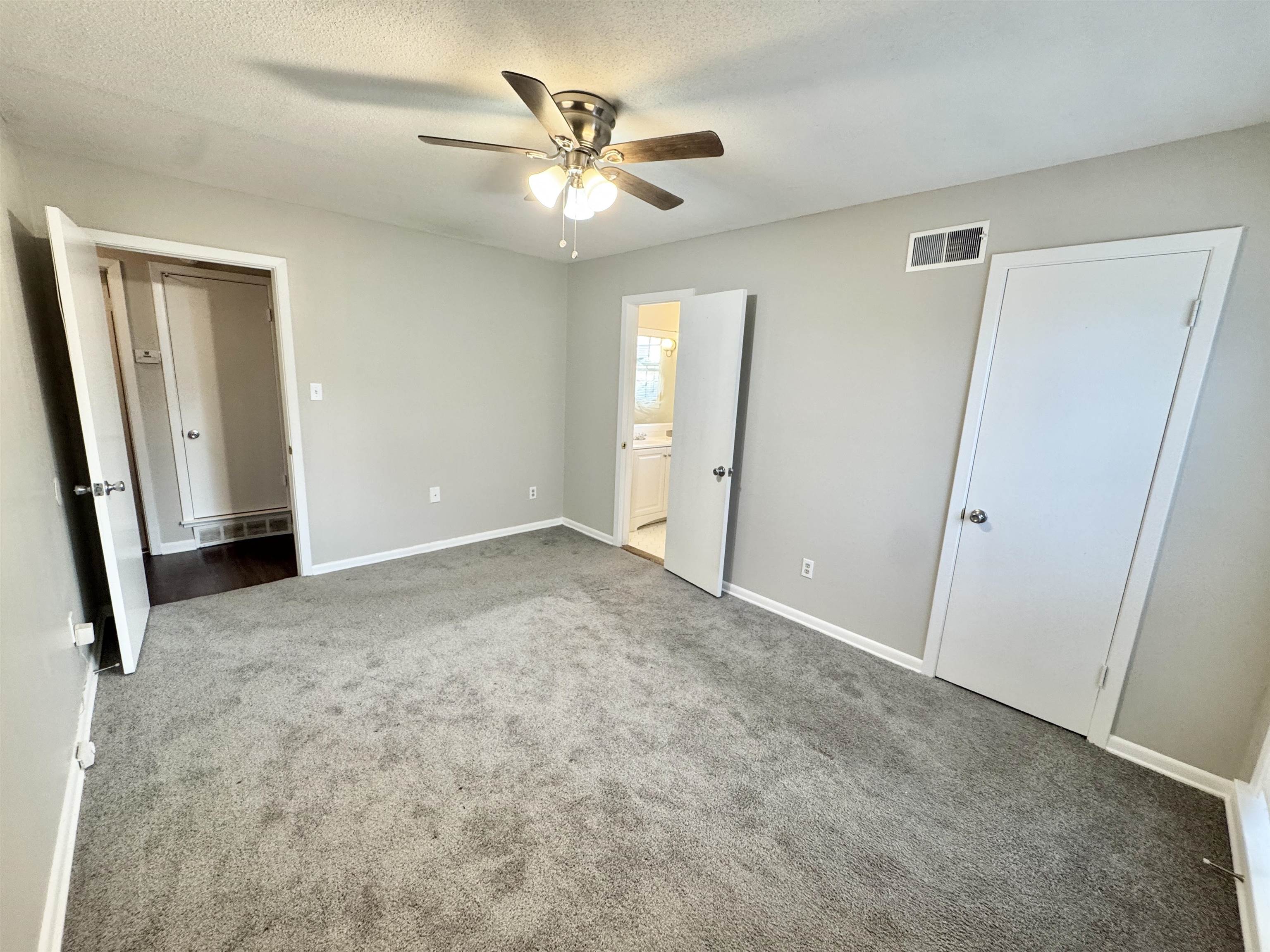 3174 Emerald Street Memphis, TN 38115 - Photo 17 of 28 an empty room with closet and a ceiling fan