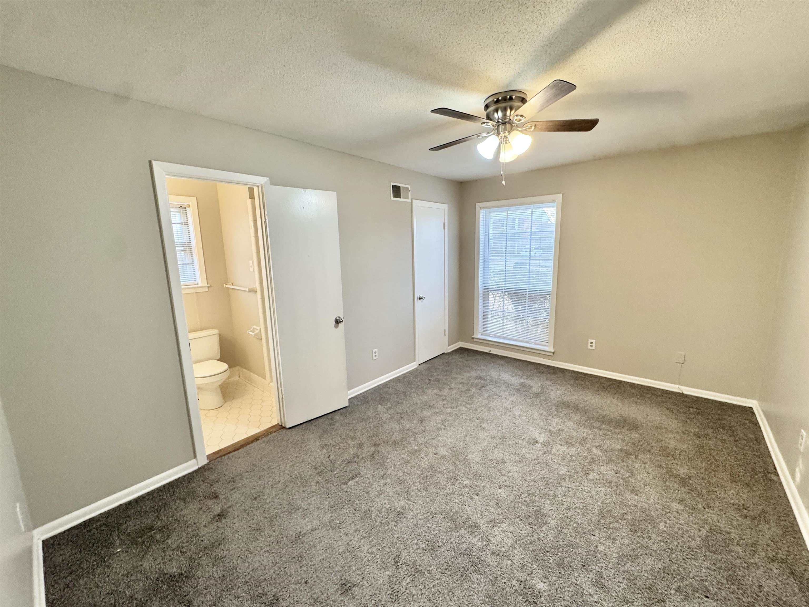 3174 Emerald Street Memphis, TN 38115 - Photo 20 of 28 an empty room with closet and a ceiling fan