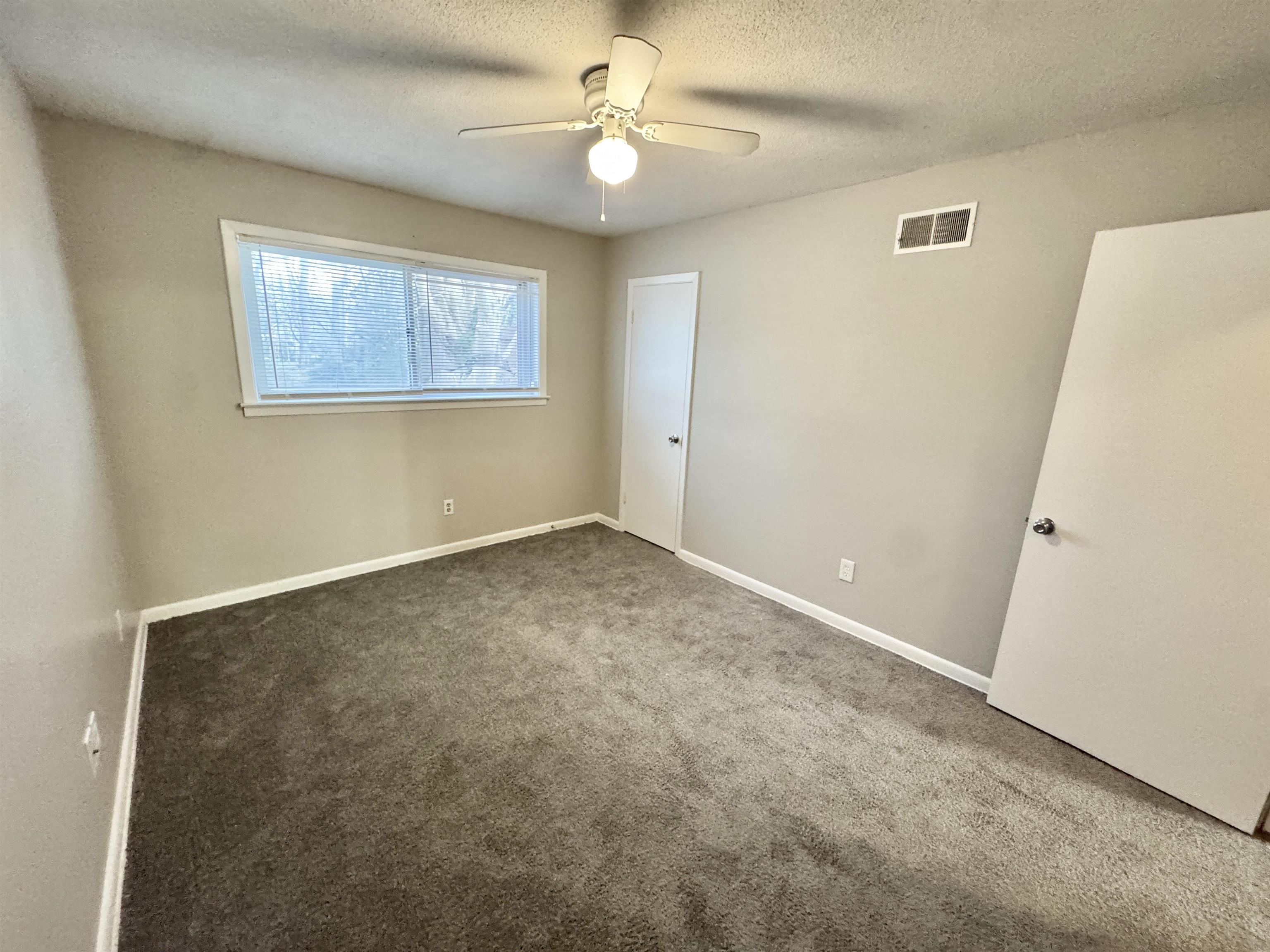 3174 Emerald Street Memphis, TN 38115 - Photo 21 of 28 a view of an empty room with a window