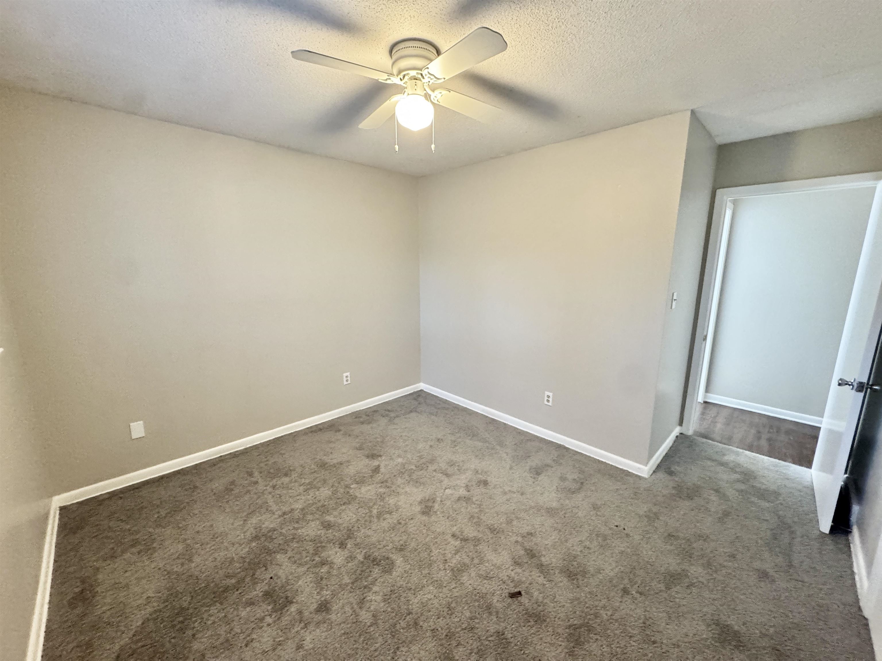 3174 Emerald Street Memphis, TN 38115 - Photo 22 of 28 an empty room with a fan and a fan