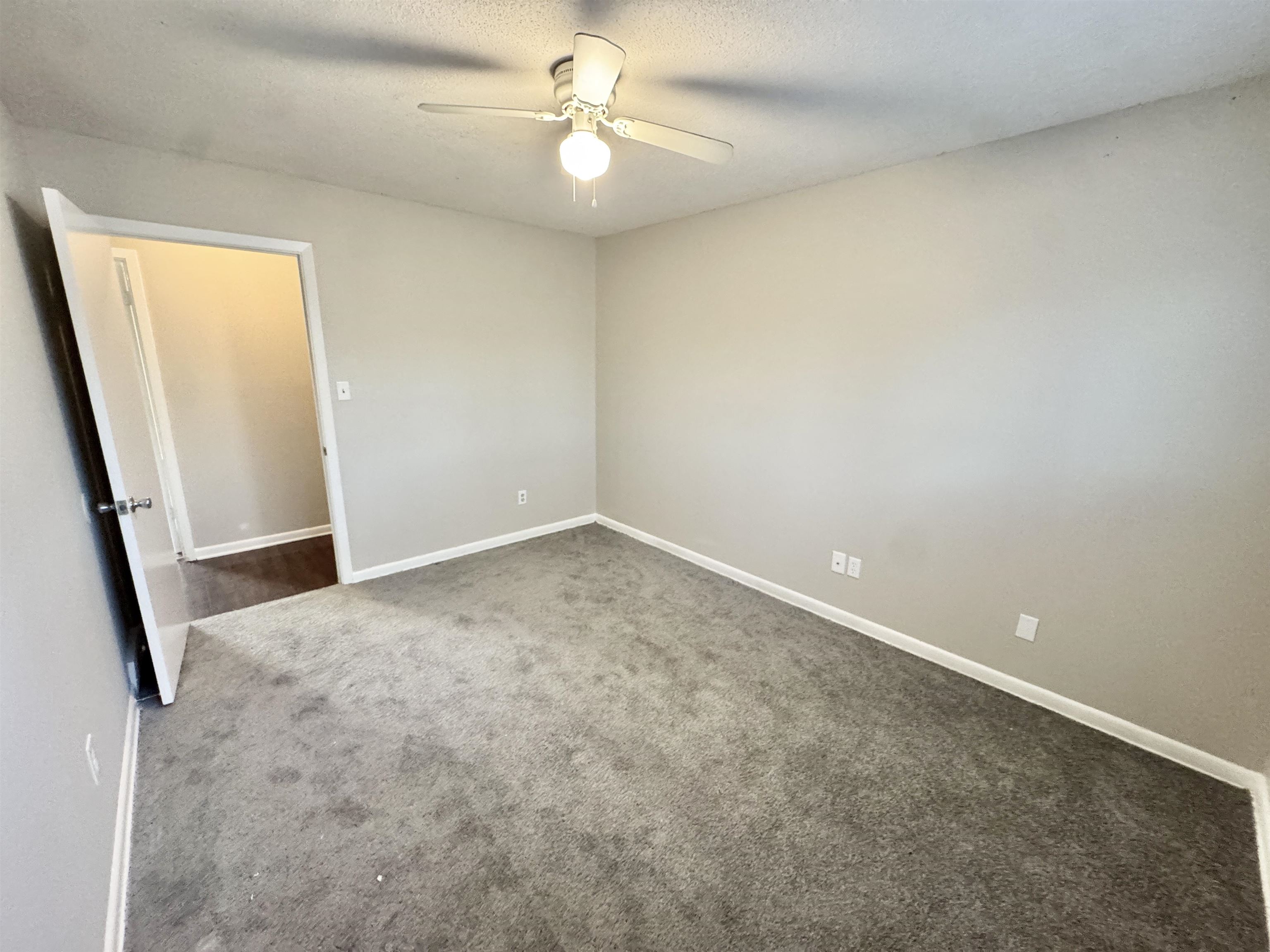 3174 Emerald Street Memphis, TN 38115 - Photo 23 of 28 an empty room with windows and fan