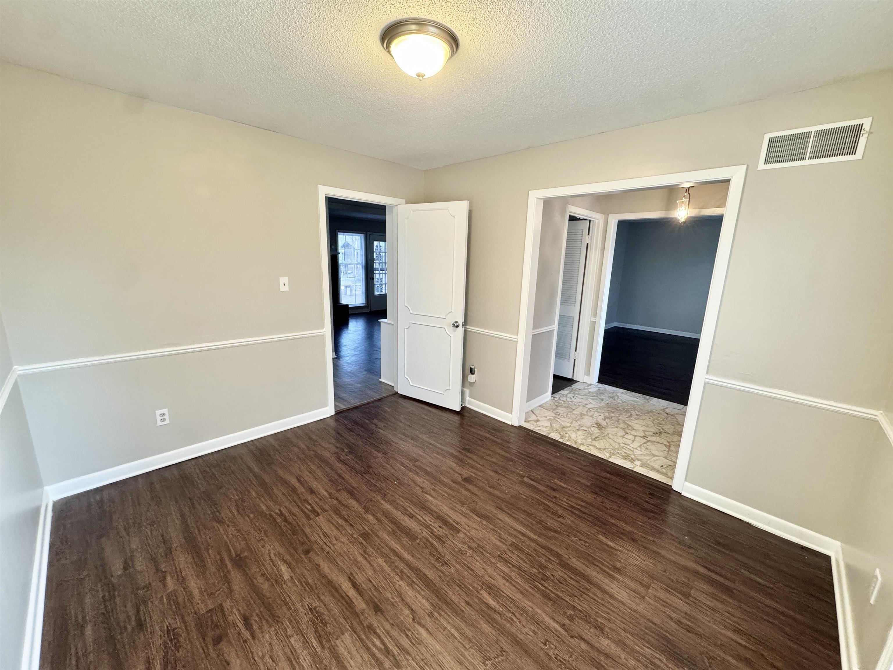 3174 Emerald Street Memphis, TN 38115 - Photo 9 of 28 wooden floor in an empty room with a window