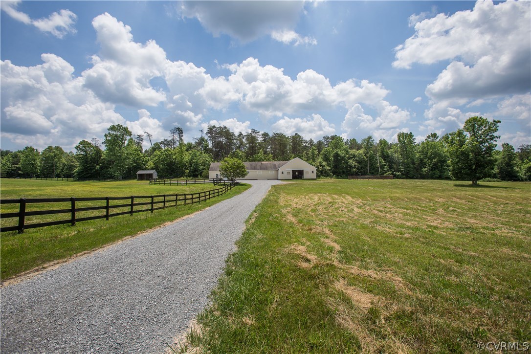 4635 Three Chopt Road Gum Spring, VA 23065 - Photo 21 of 37 a view of a golf course with a lake