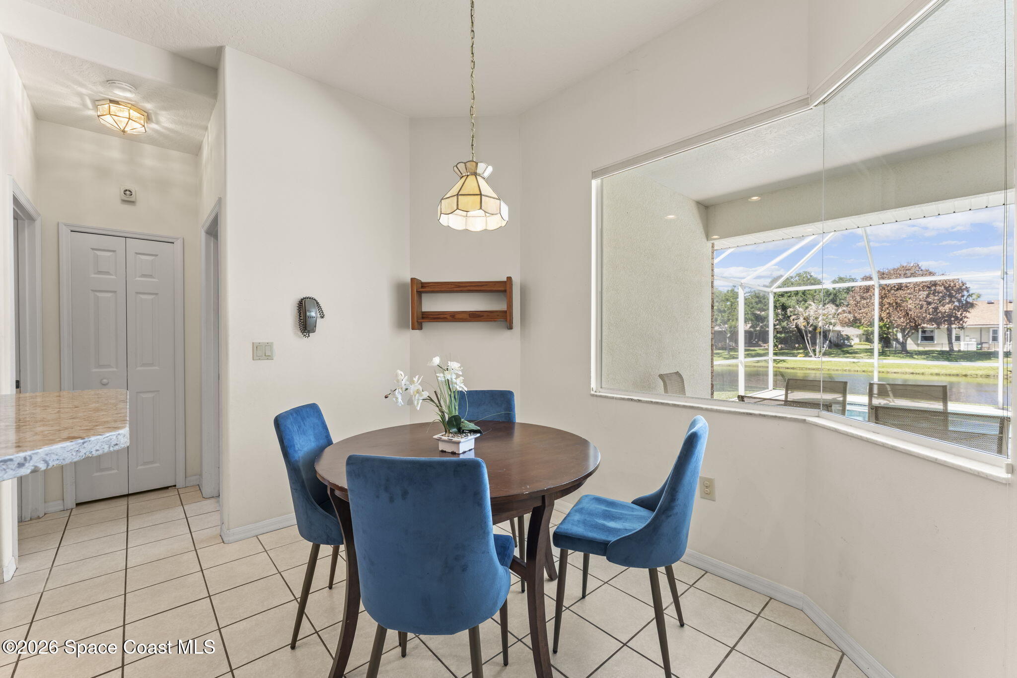 1123 Spring Oak Drive Melbourne, FL 32901 - Photo 24 of 67 a view of a dining room with furniture window and outside view