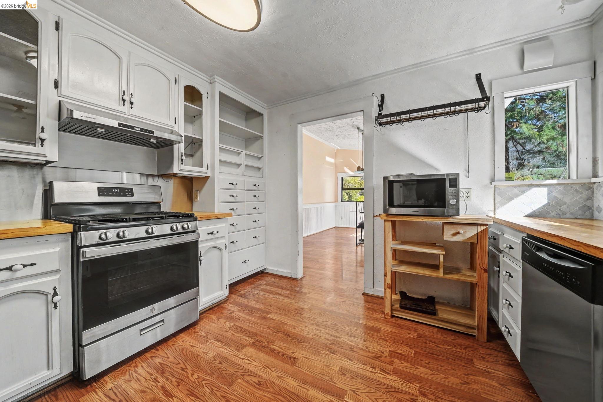 731 Dam Road Murphys, CA 95247 - Photo 14 of 60 a kitchen with stainless steel appliances a stove a microwave and a refrigerator