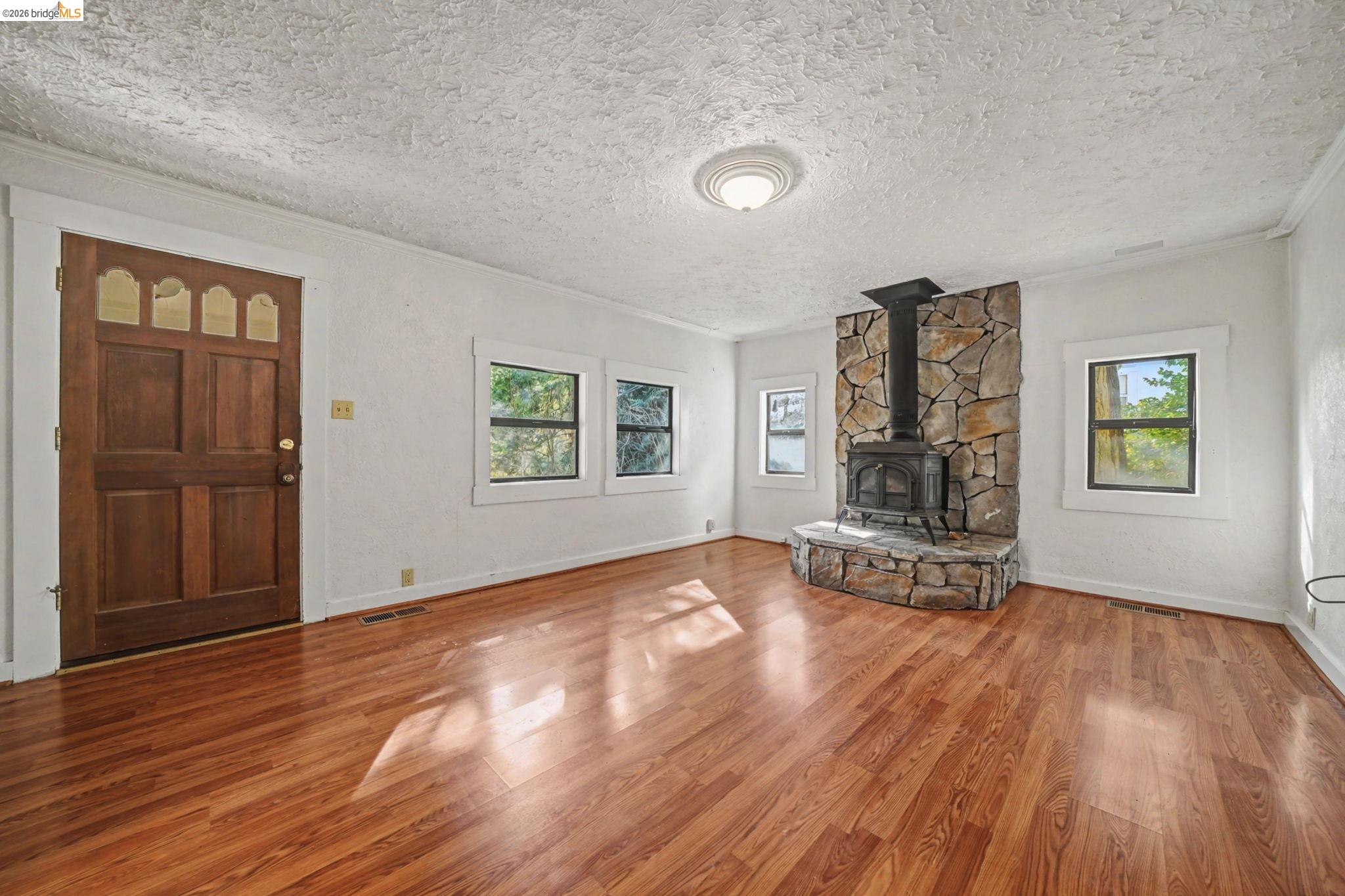 731 Dam Road Murphys, CA 95247 - Photo 20 of 60 a view of empty room with wooden floor and fan