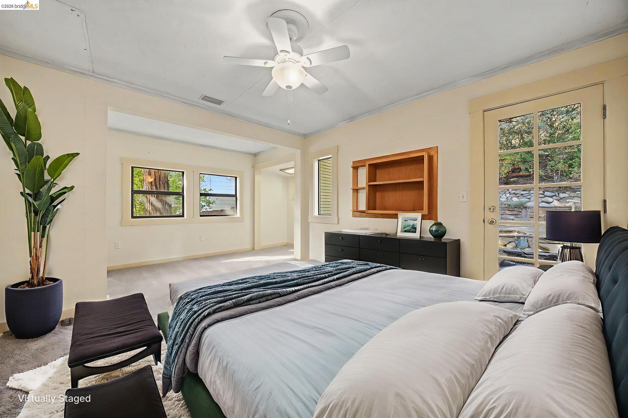 731 Dam Road Murphys, CA 95247 - Photo 26 of 60 a bedroom with a large bed couch and a window