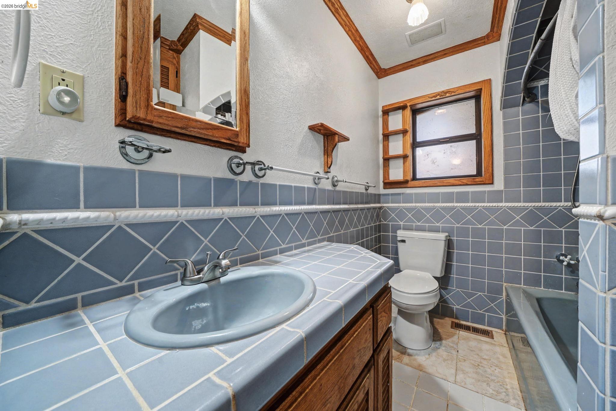 731 Dam Road Murphys, CA 95247 - Photo 27 of 60 a bathroom with a sink a toilet and a mirror