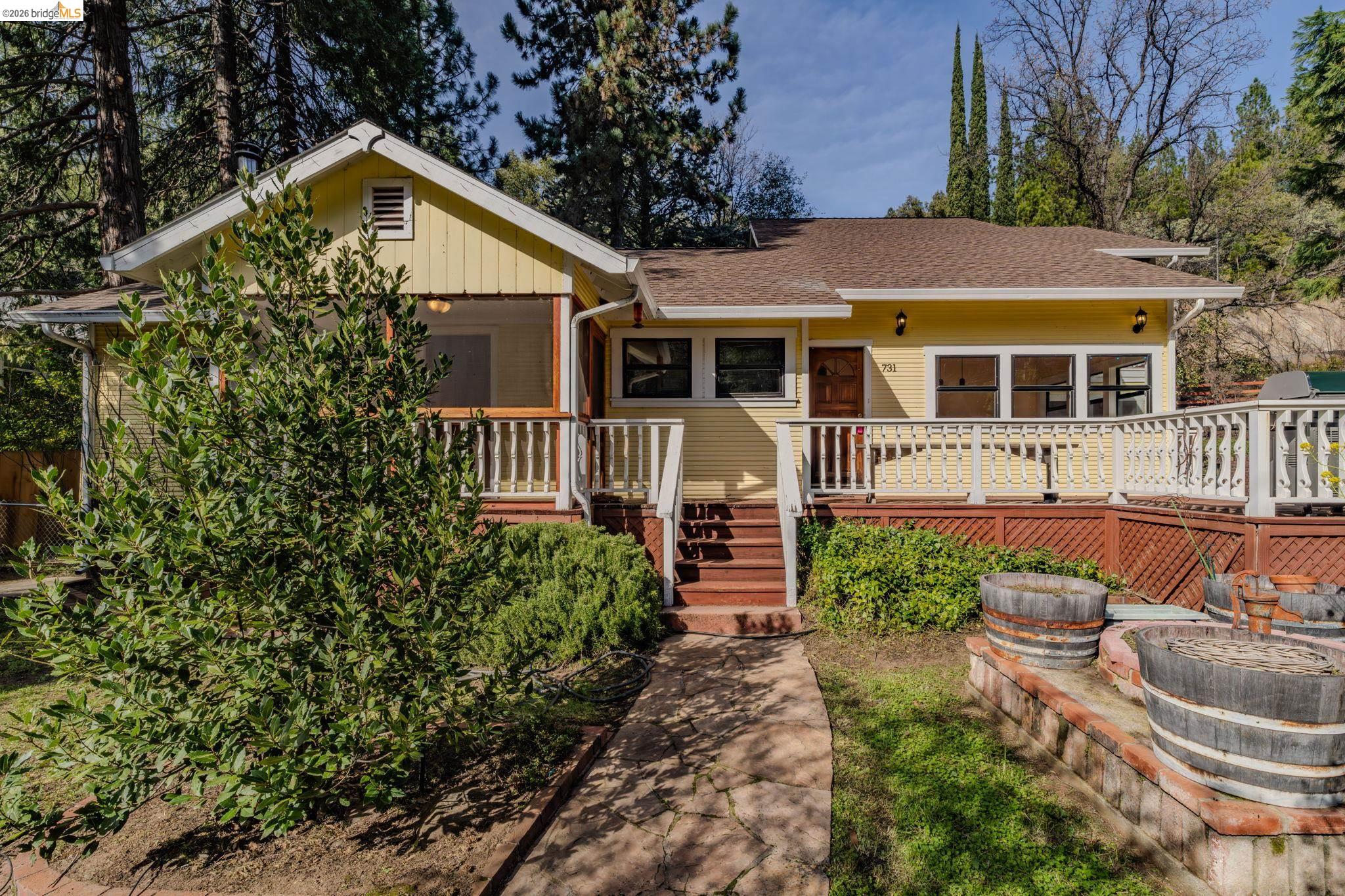 731 Dam Road Murphys, CA 95247 - Photo 3 of 60 a front view of a house with garden