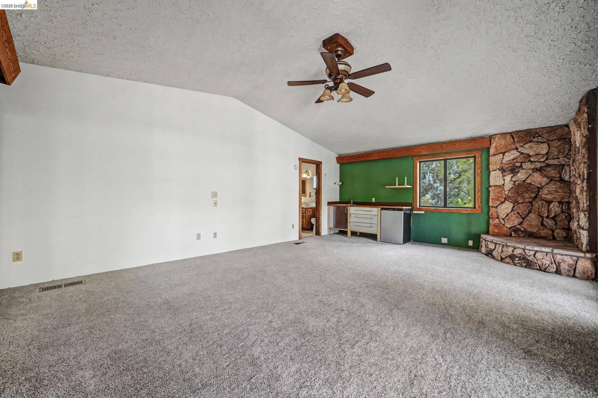 731 Dam Road Murphys, CA 95247 - Photo 34 of 60 a view of a livingroom with a ceiling fan and window
