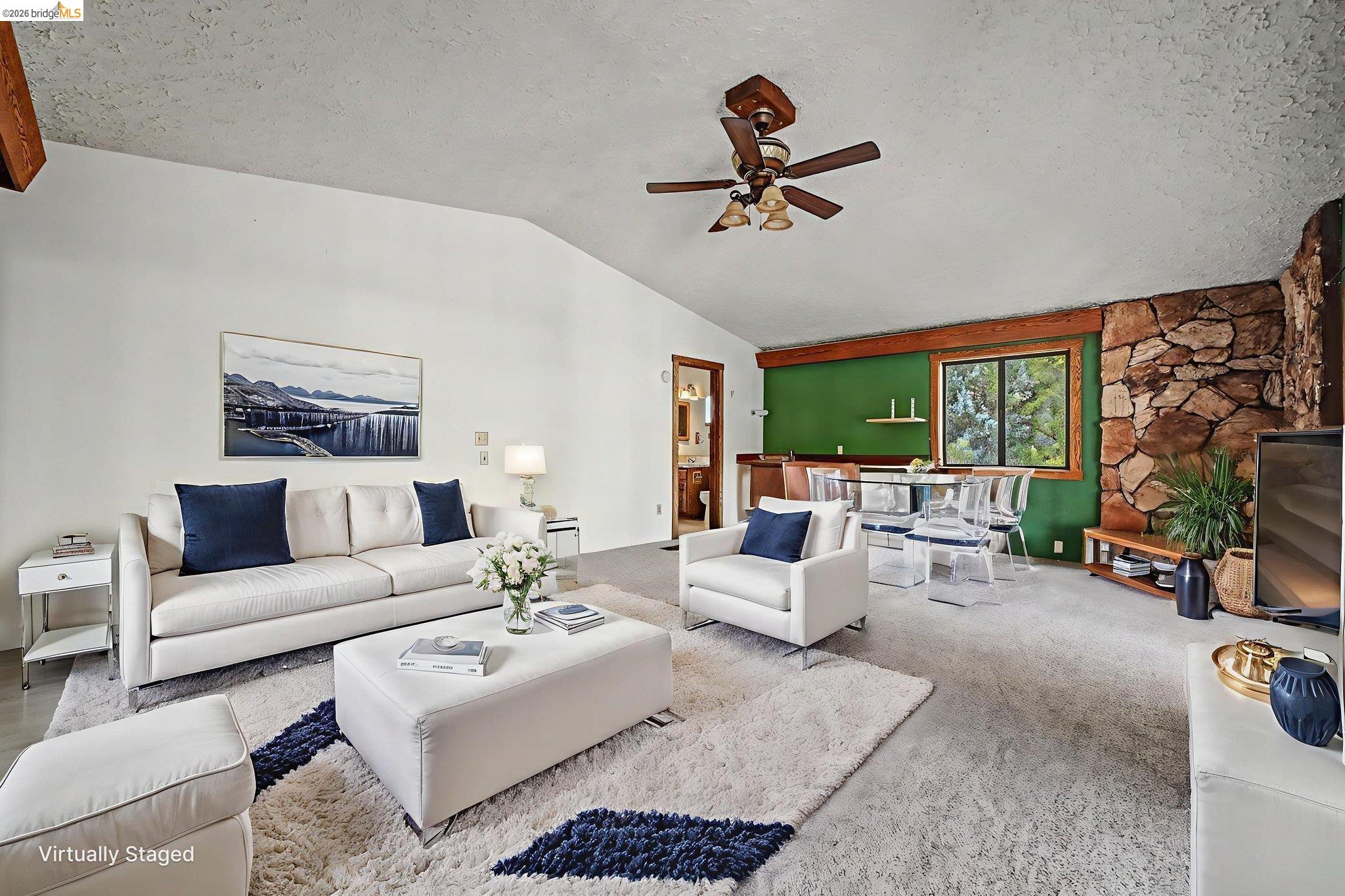 731 Dam Road Murphys, CA 95247 - Photo 37 of 60 a living room with furniture ceiling fan and a large window