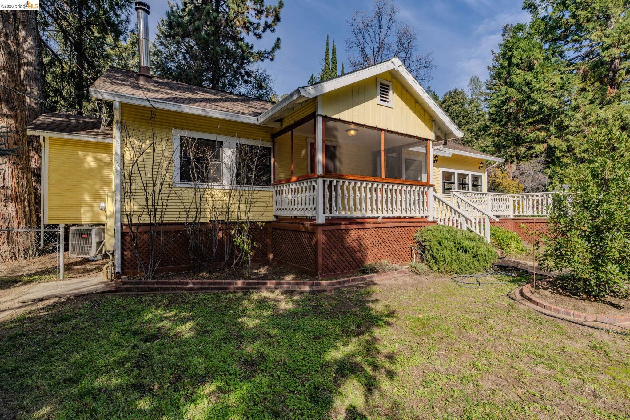 731 Dam Road Murphys, CA 95247 - Photo 5 of 60 front view of a house with a yard