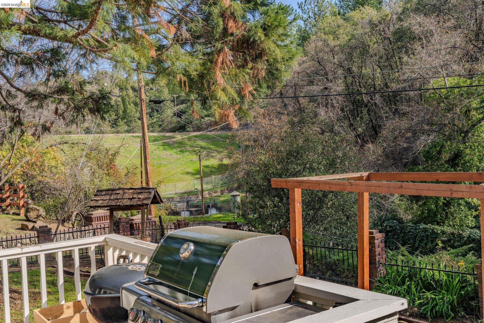 731 Dam Road Murphys, CA 95247 - Photo 54 of 60 a view of a patio with table and chairs and wooden fence