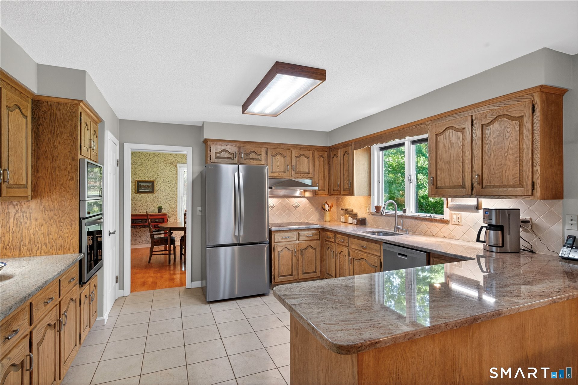 5 Shingle Mill Drive Canton, CT 06019 - Photo 9 of 38 a kitchen with stainless steel appliances granite countertop a refrigerator and a stove