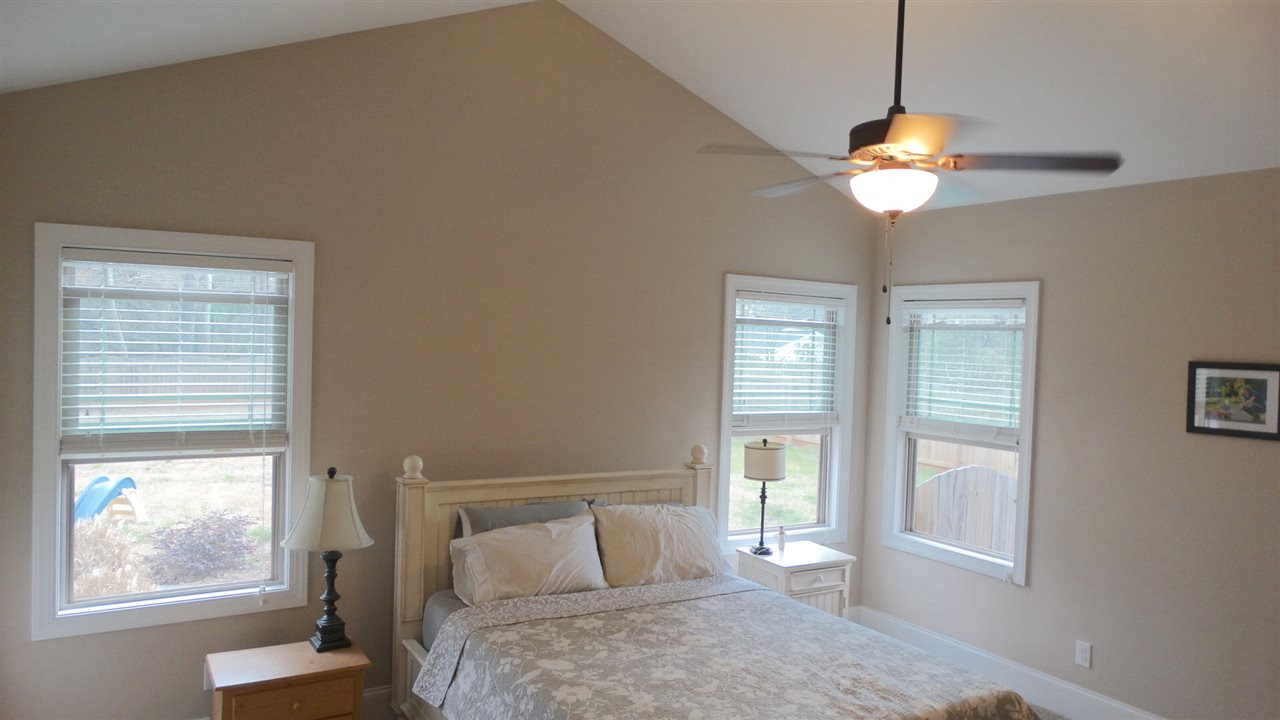 1308 Trinity Circle Raleigh, NC 27607 - Photo 9 of 25 Cathedral Ceiling, Ceiling Fan and a lovely En Suite on the First Floor. Pure Zen! Master Bedroom