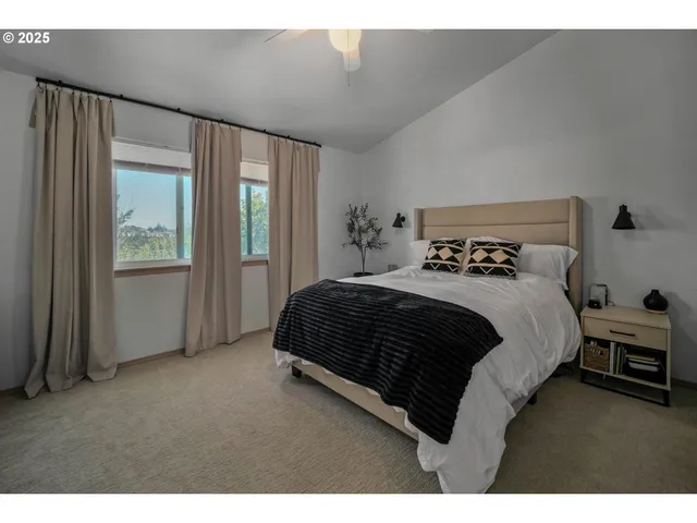 a bedroom with a bed and a table