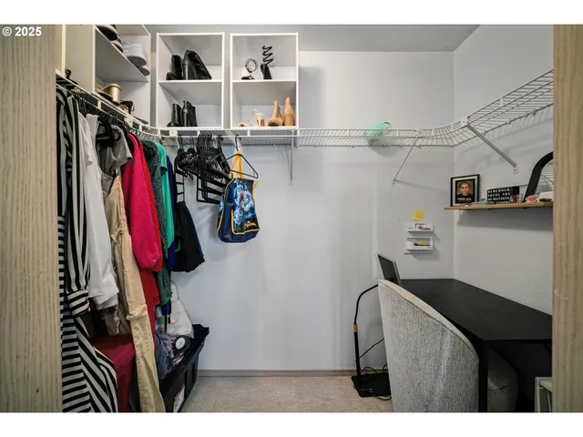 a bedroom with a bed and a cabinets