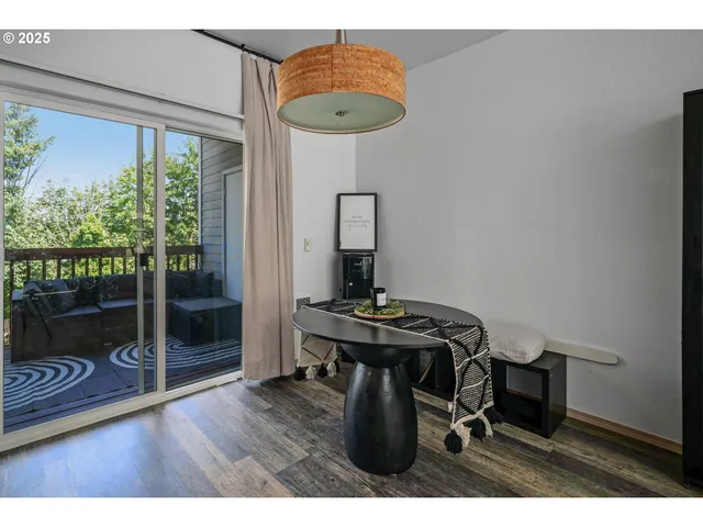 a view of a workspace with furniture and window