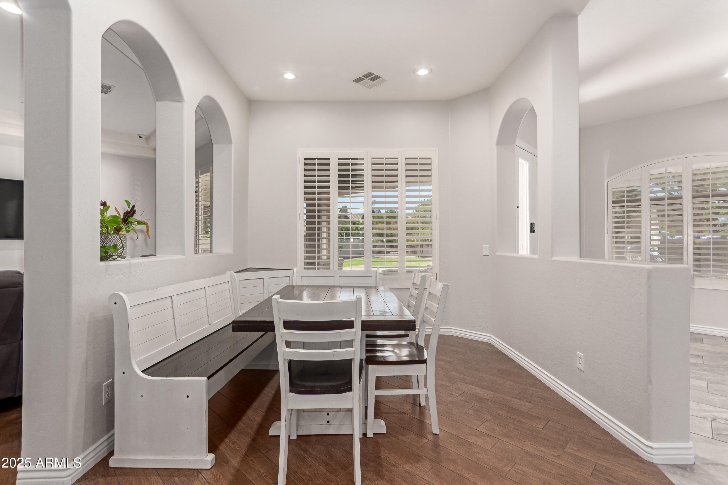 4584 East Reins Road Gilbert, AZ 85297 - Photo 12 of 58 a view of a dining room with furniture and windows