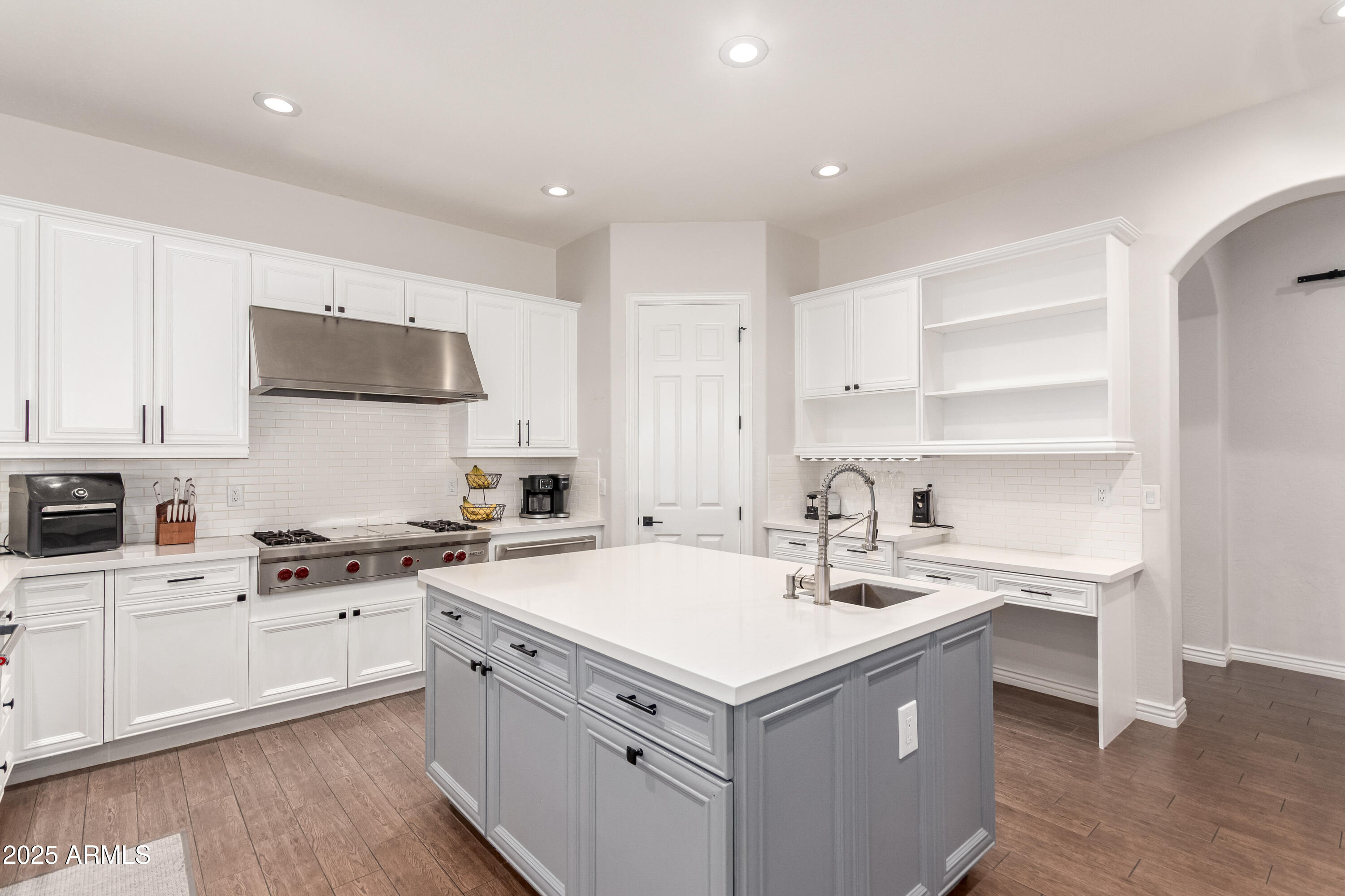 4584 East Reins Road Gilbert, AZ 85297 - Photo 13 of 58 a kitchen that has a sink and a stove in it