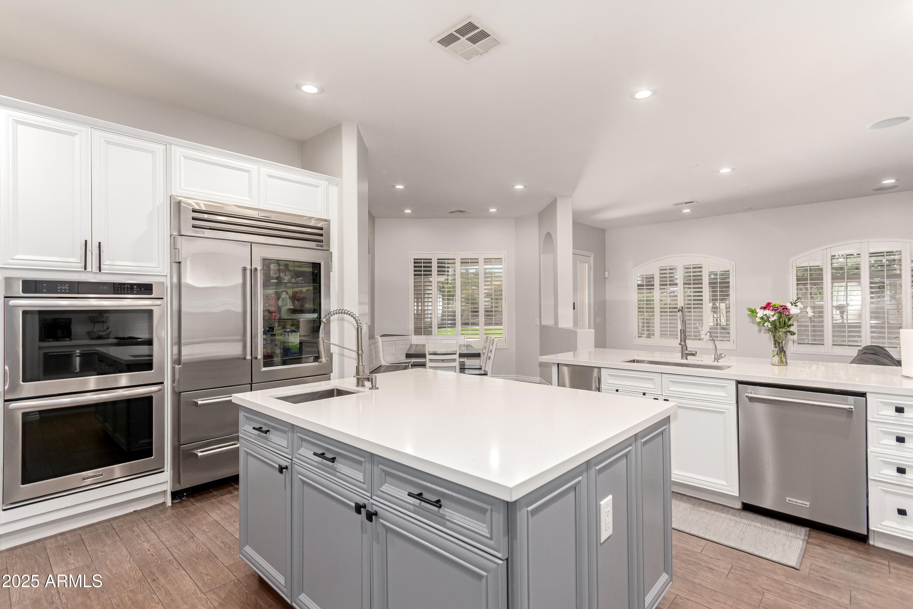 4584 East Reins Road Gilbert, AZ 85297 - Photo 15 of 58 a kitchen with a stove and a sink