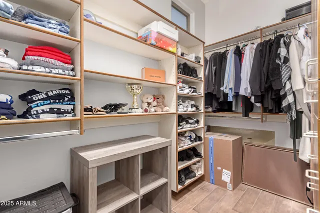 a bathroom with a double vanity sink and mirror