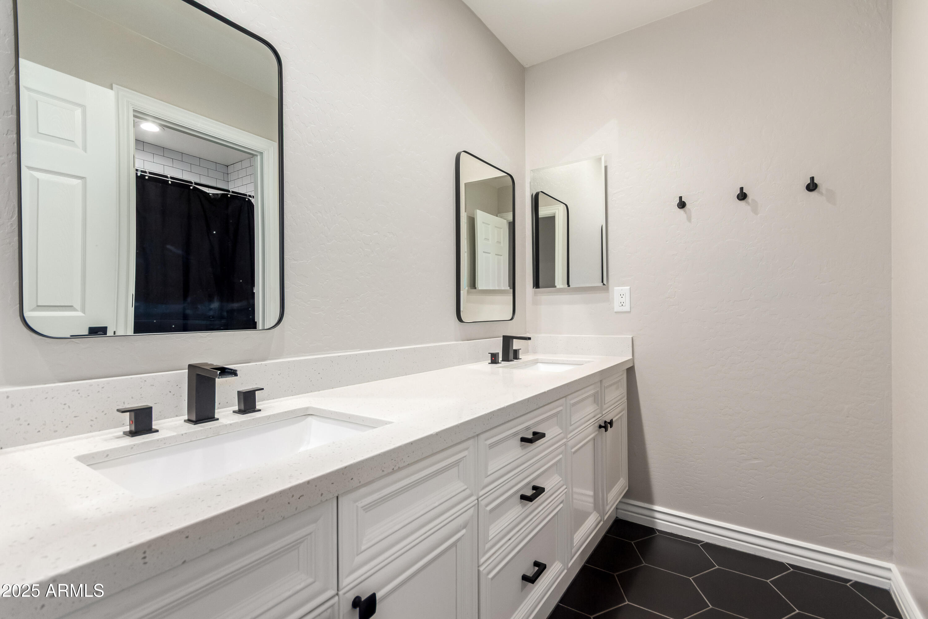 4584 East Reins Road Gilbert, AZ 85297 - Photo 26 of 58 a bathroom with a double vanity sink and mirror