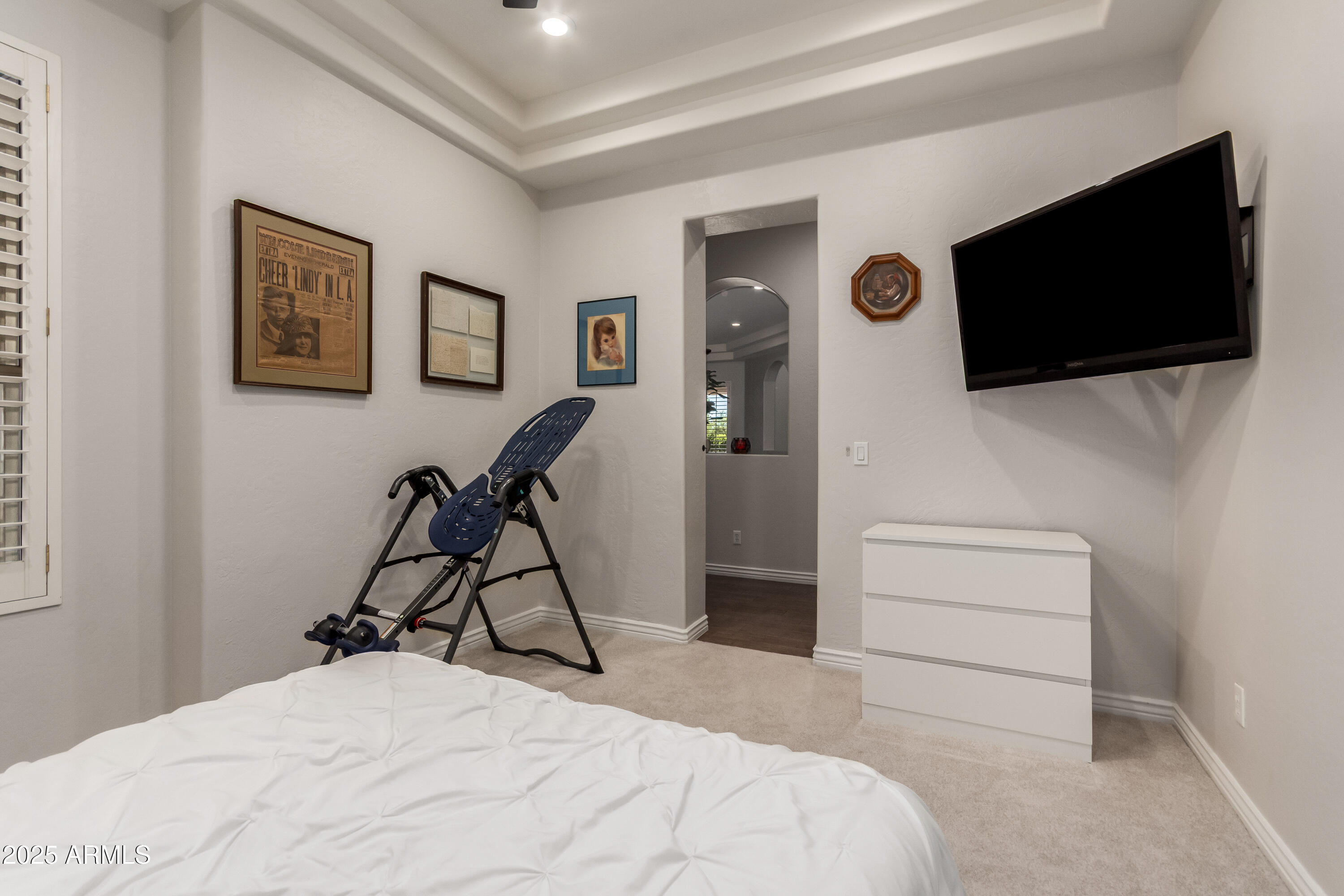 4584 East Reins Road Gilbert, AZ 85297 - Photo 31 of 58 a bedroom with a bed and a flat screen tv