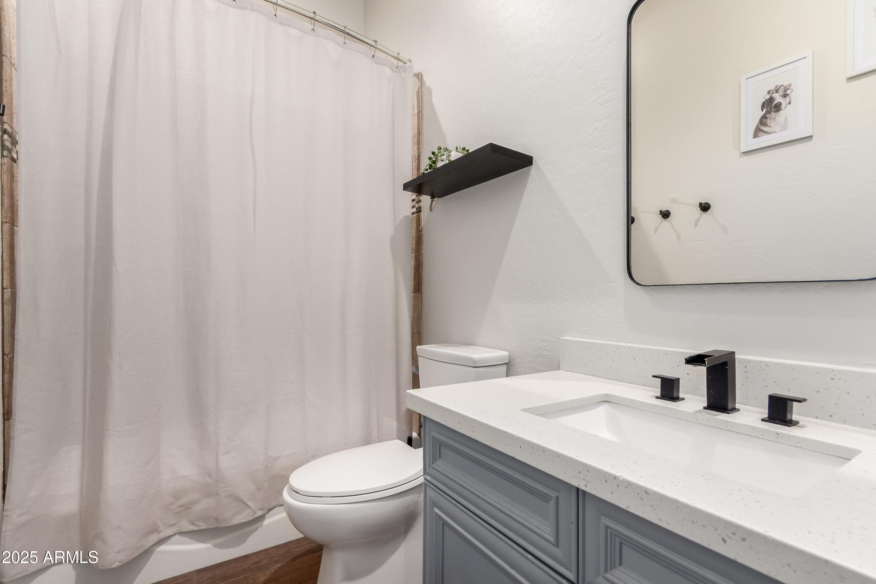 4584 East Reins Road Gilbert, AZ 85297 - Photo 32 of 58 a bathroom with a granite countertop sink and a toilet