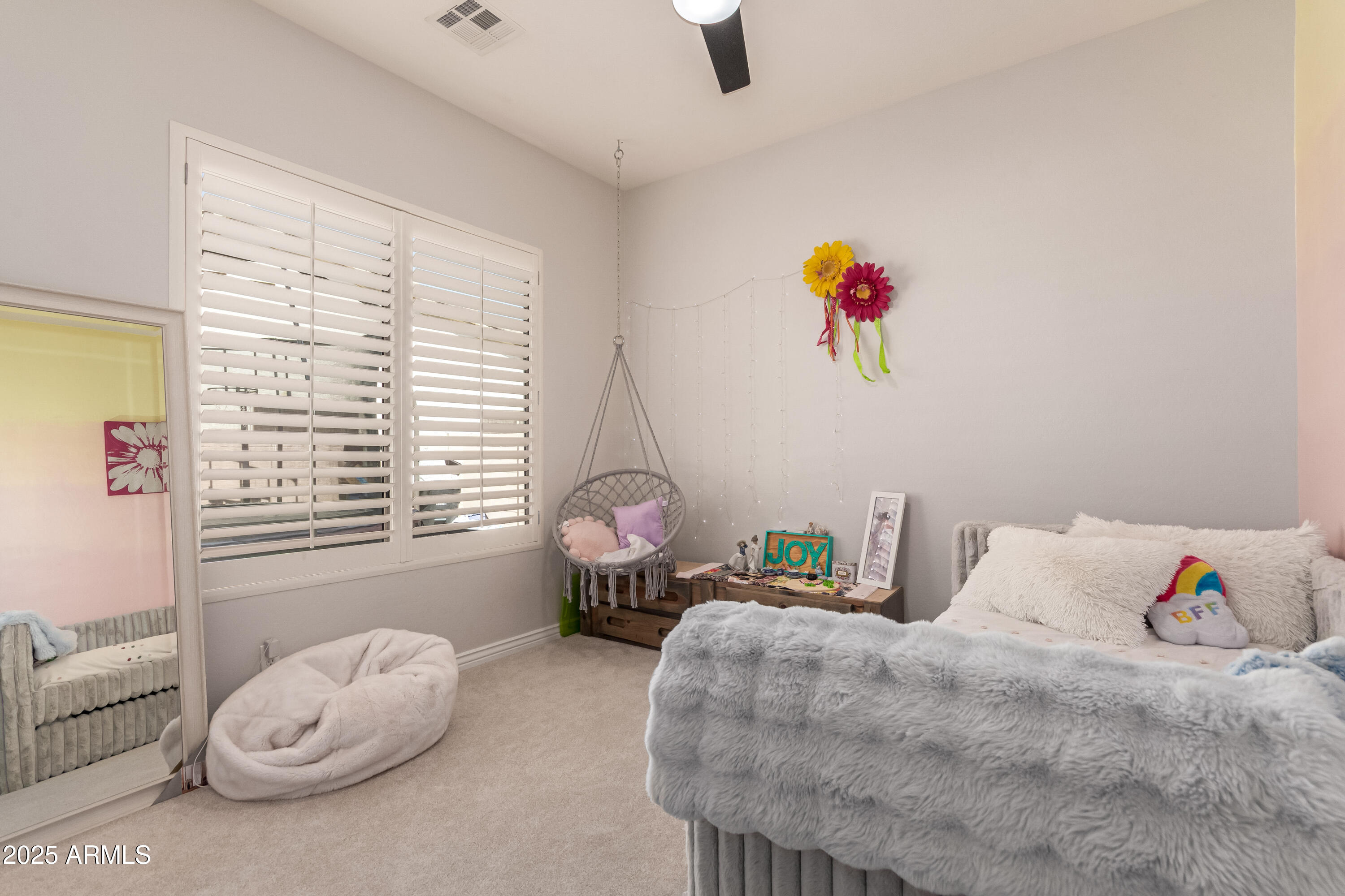 4584 East Reins Road Gilbert, AZ 85297 - Photo 35 of 58 a bedroom with a bed and a large window