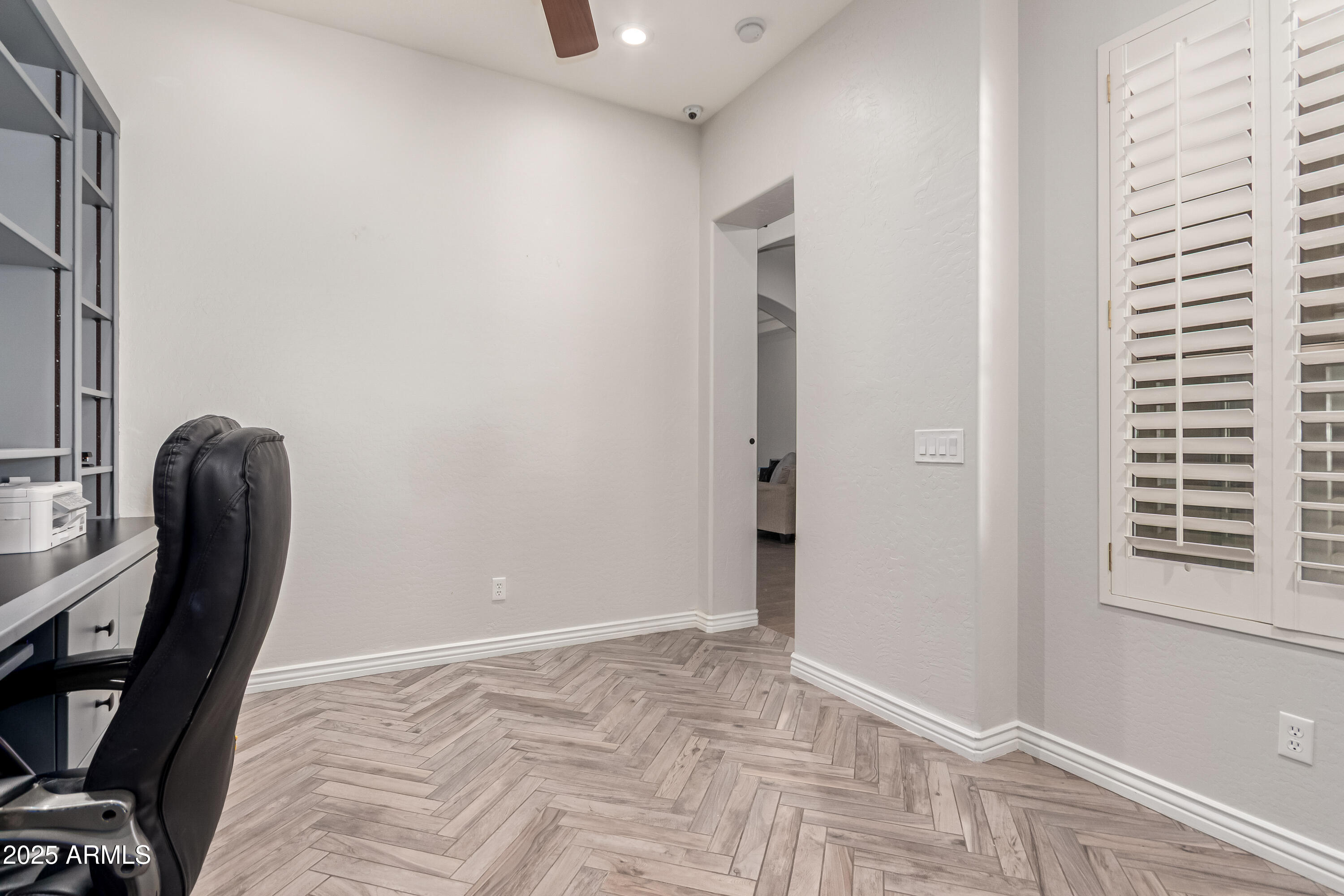 4584 East Reins Road Gilbert, AZ 85297 - Photo 38 of 58 a view of a workspace with furniture and a window