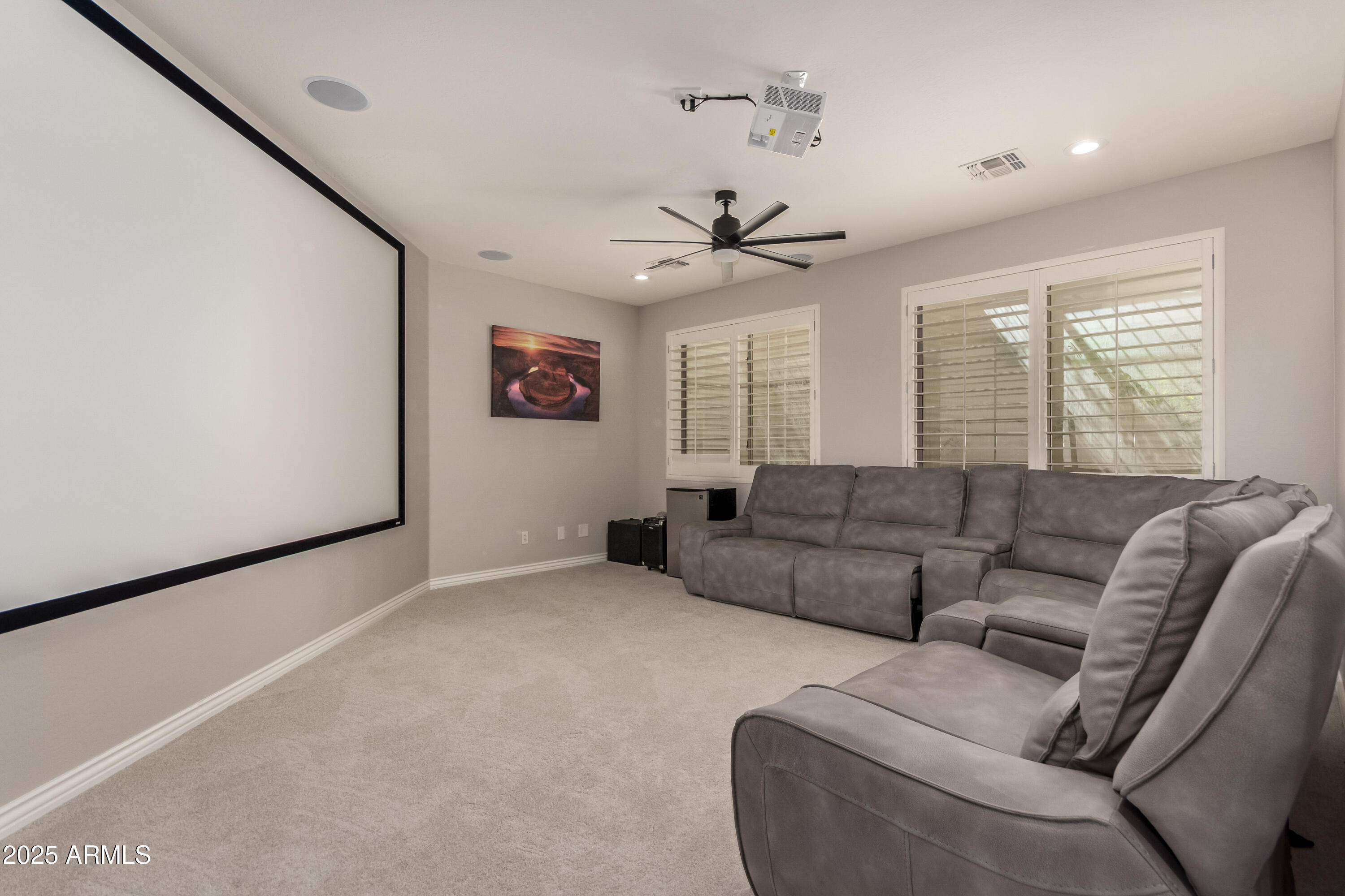 4584 East Reins Road Gilbert, AZ 85297 - Photo 39 of 58 a living room with furniture and a large window