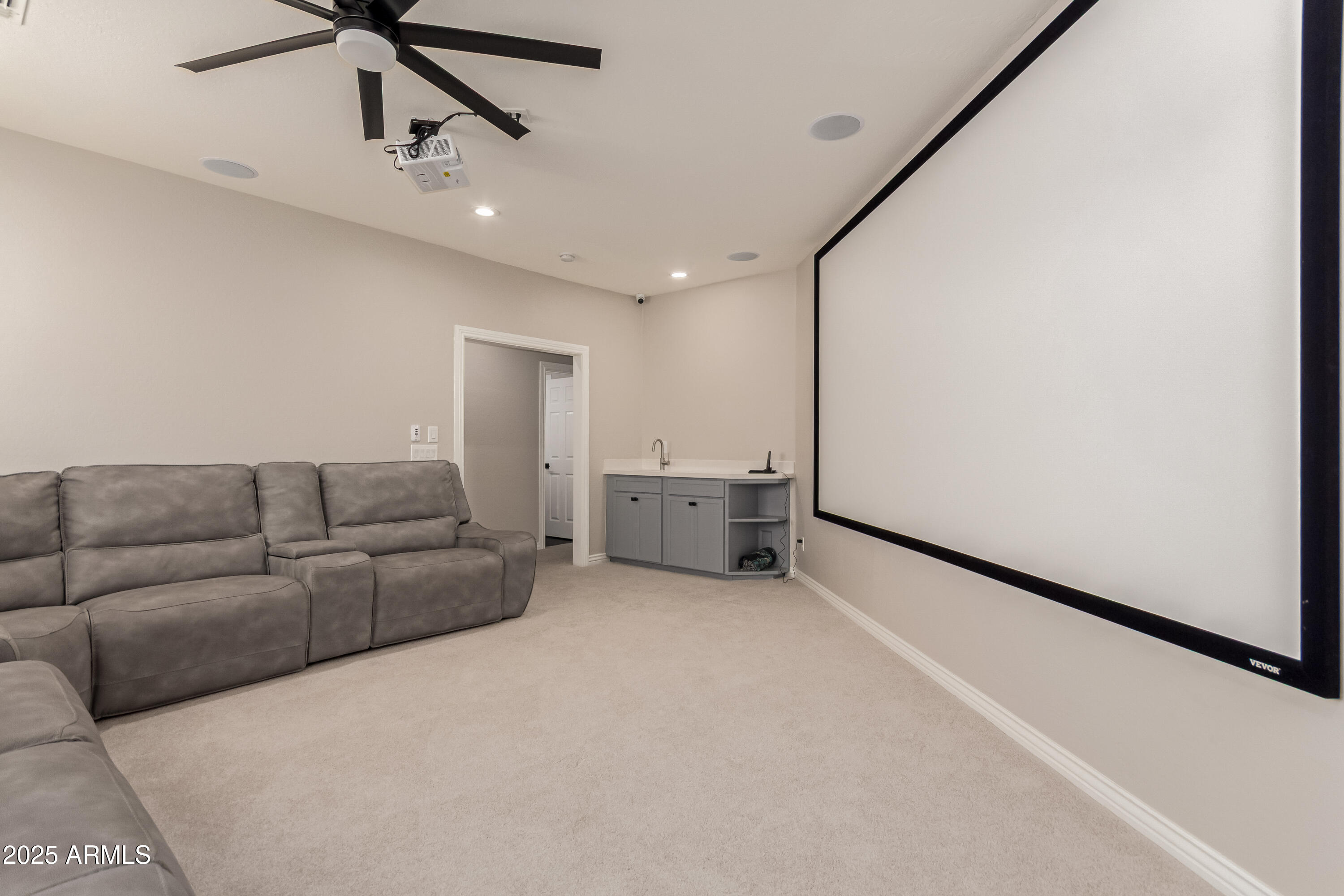 4584 East Reins Road Gilbert, AZ 85297 - Photo 40 of 58 a living room with furniture and ceiling fan