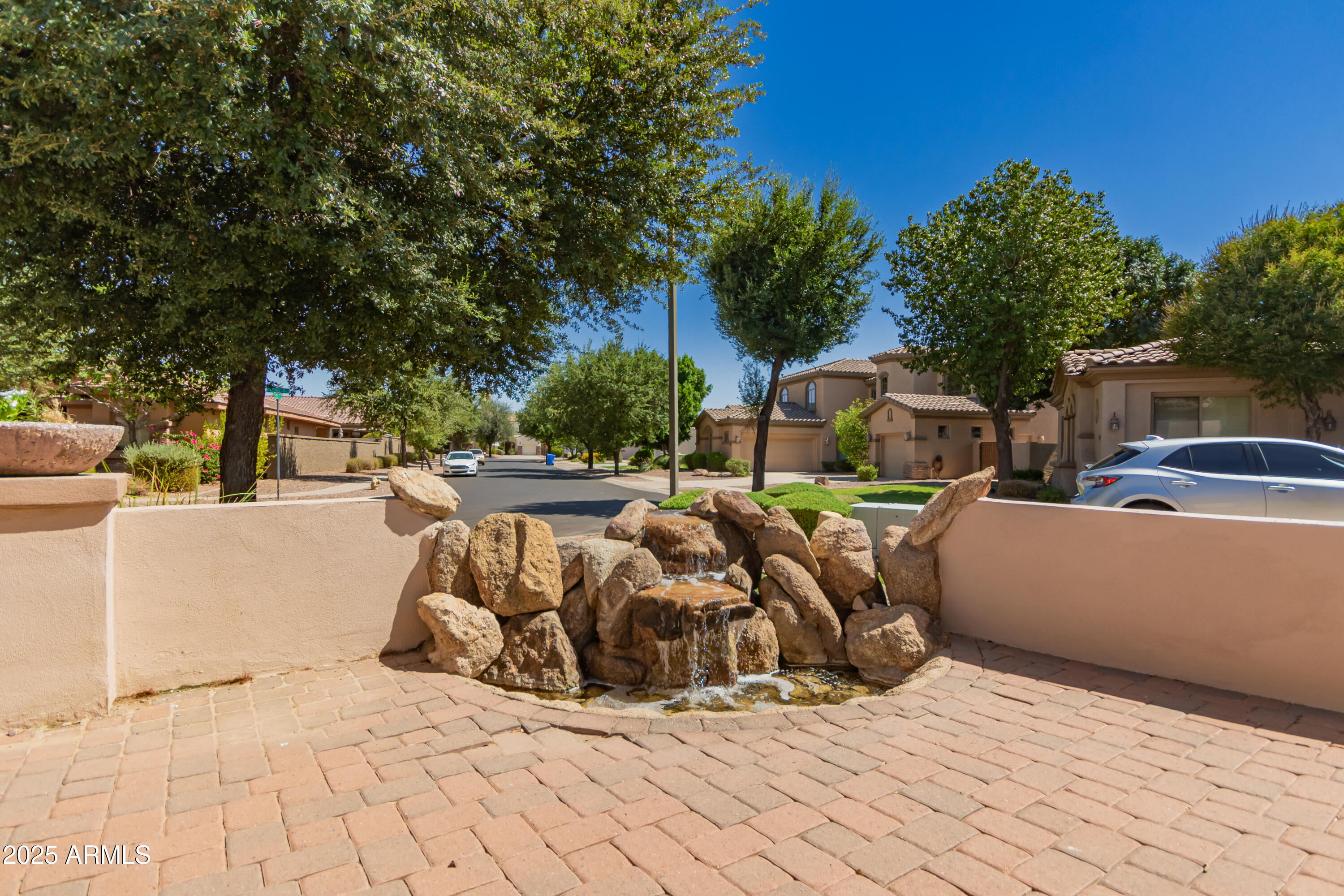 4584 East Reins Road Gilbert, AZ 85297 - Photo 4 of 58 a view of roof deck with couches and wooden fence