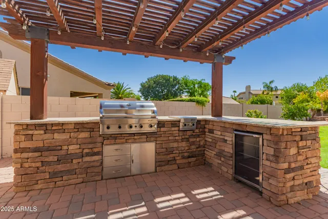 a view of a house with pool and a yard