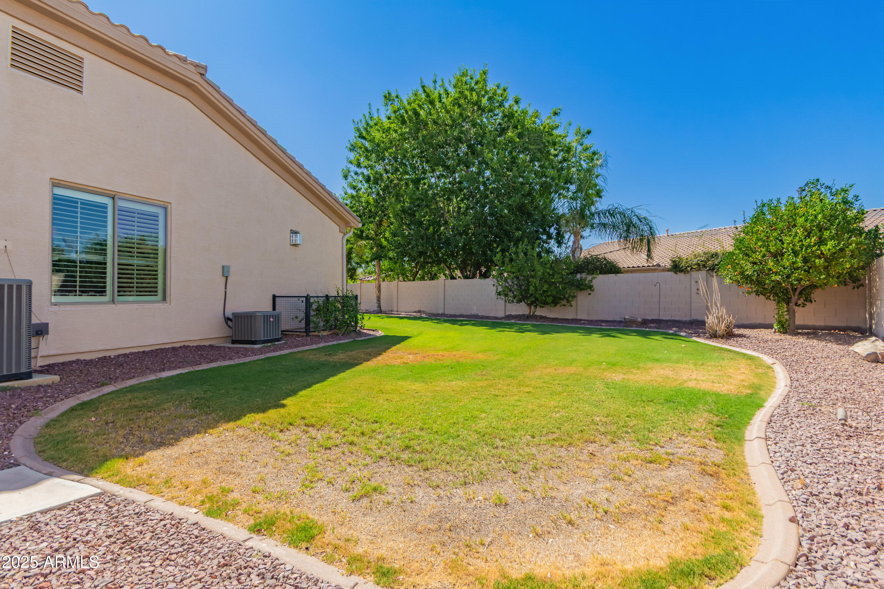 4584 East Reins Road Gilbert, AZ 85297 - Photo 49 of 58 a view of a swimming pool with a patio