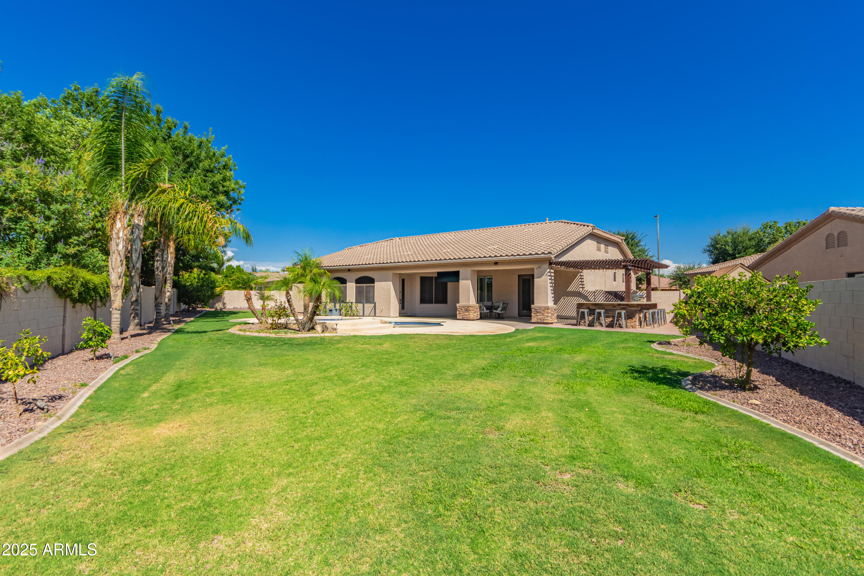 4584 East Reins Road Gilbert, AZ 85297 - Photo 50 of 58 a front view of house with yard and green space