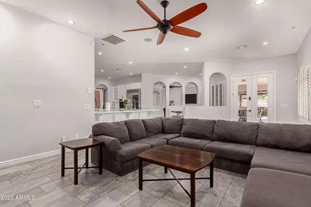 a living room with fireplace and a flat screen tv