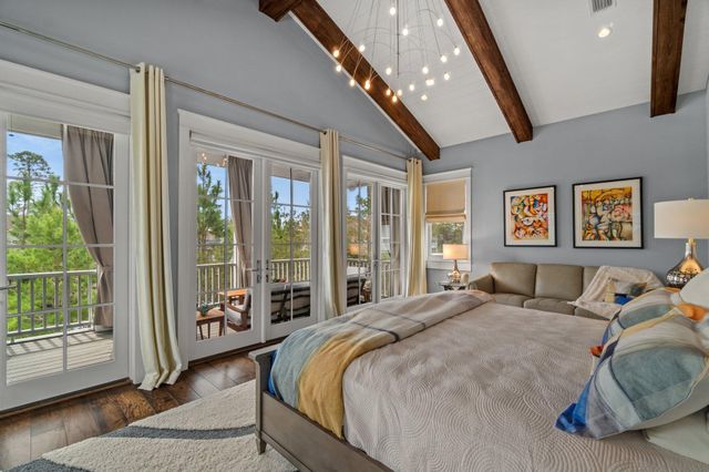 a balcony with furniture and a potted plant